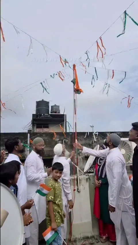 Flag hoisting ceremony at The Noble Mission School with tricolour bunting overhead